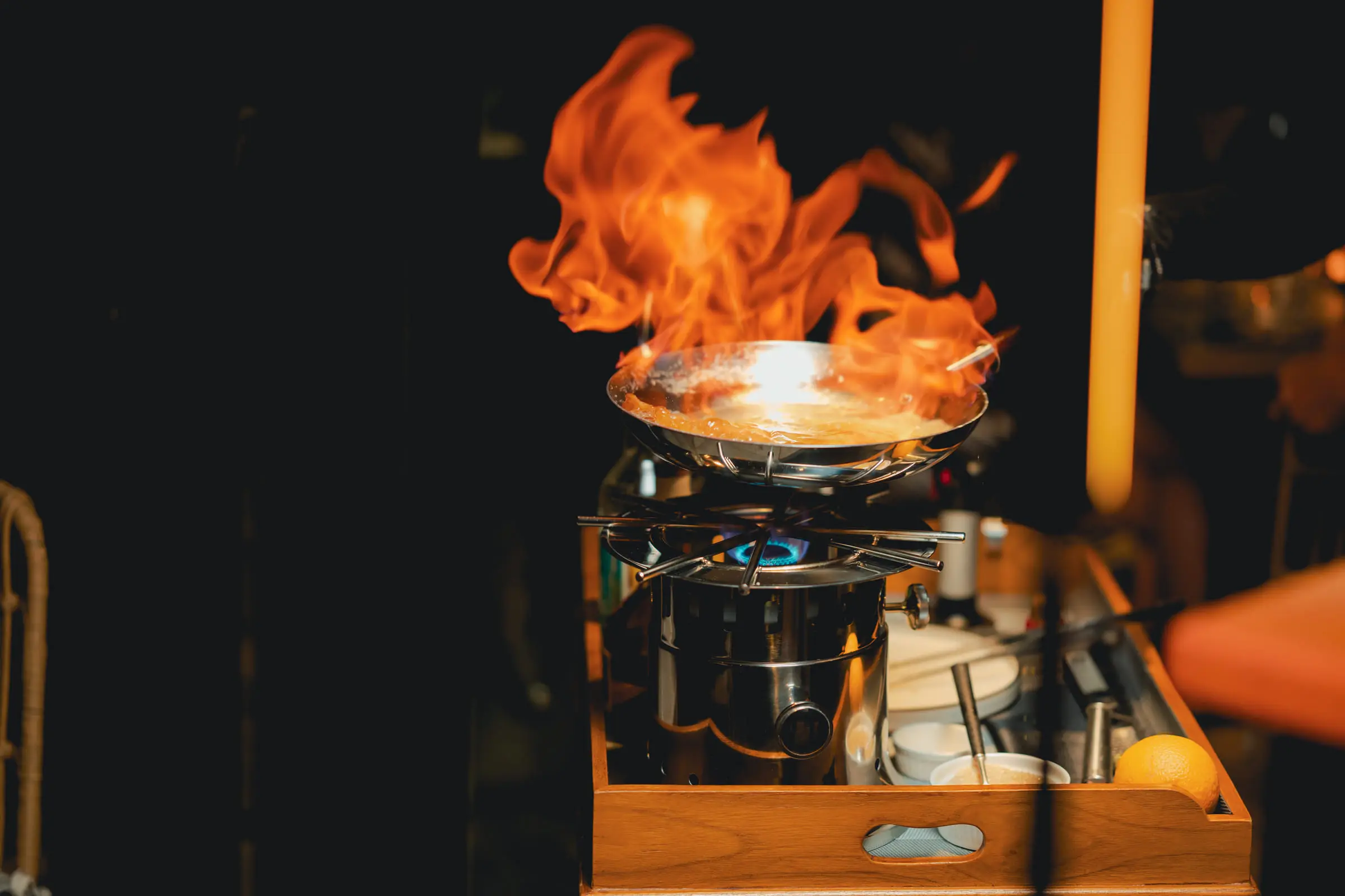 Flames rising from the pan at the live cooking station