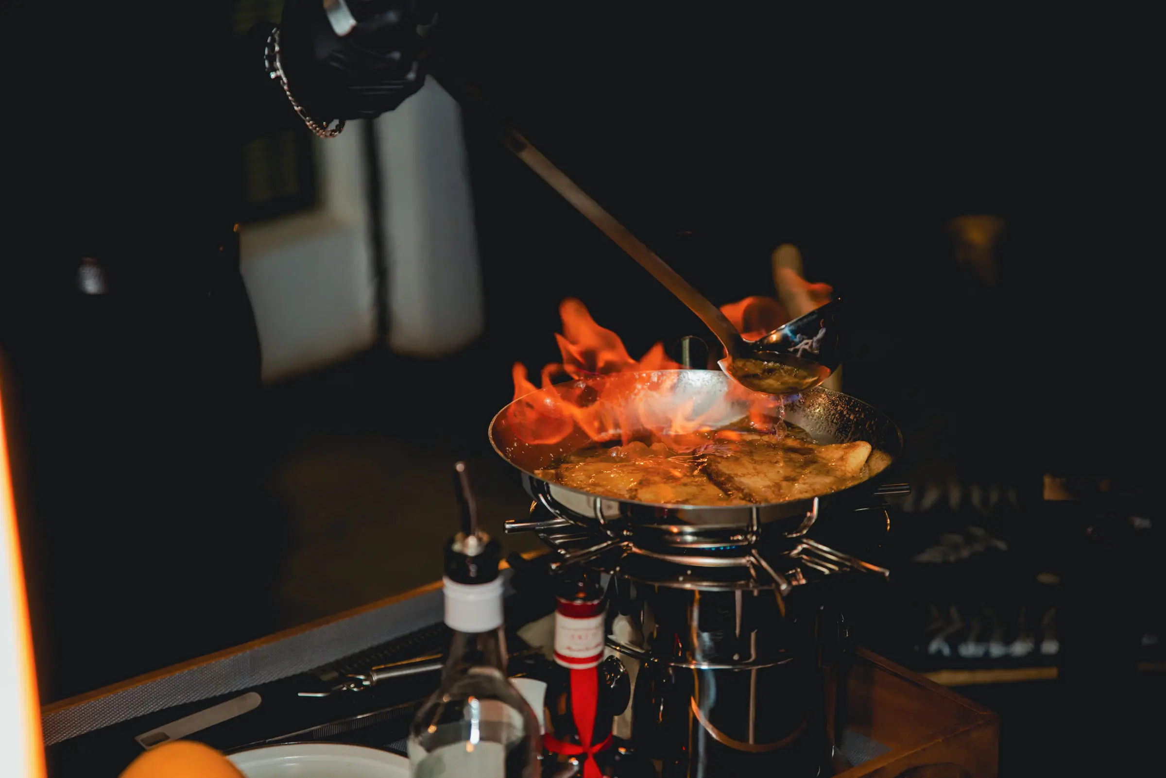 Live cooking on the gueridon trolley, beside the table