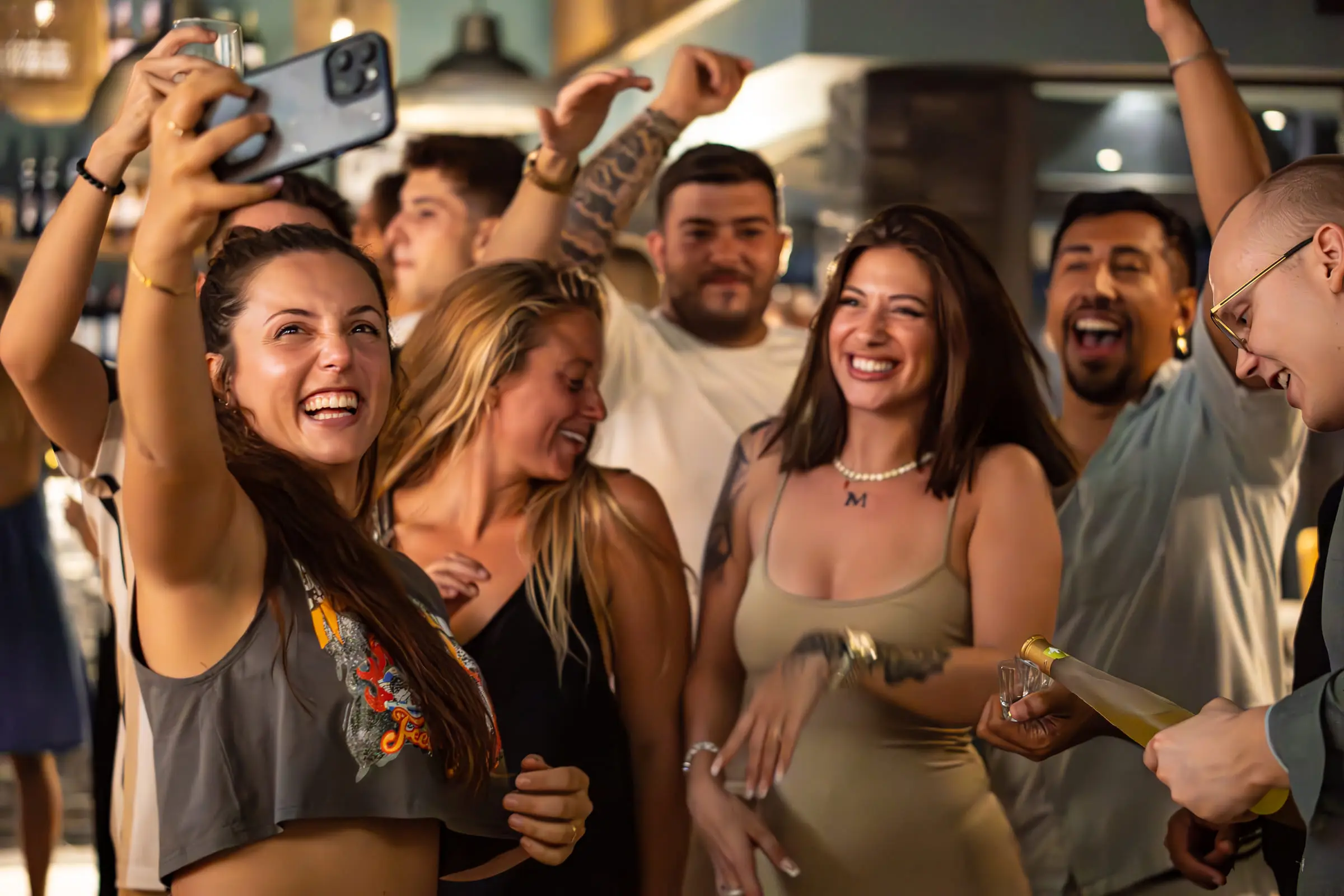 Friends celebrating on the floor during a private party