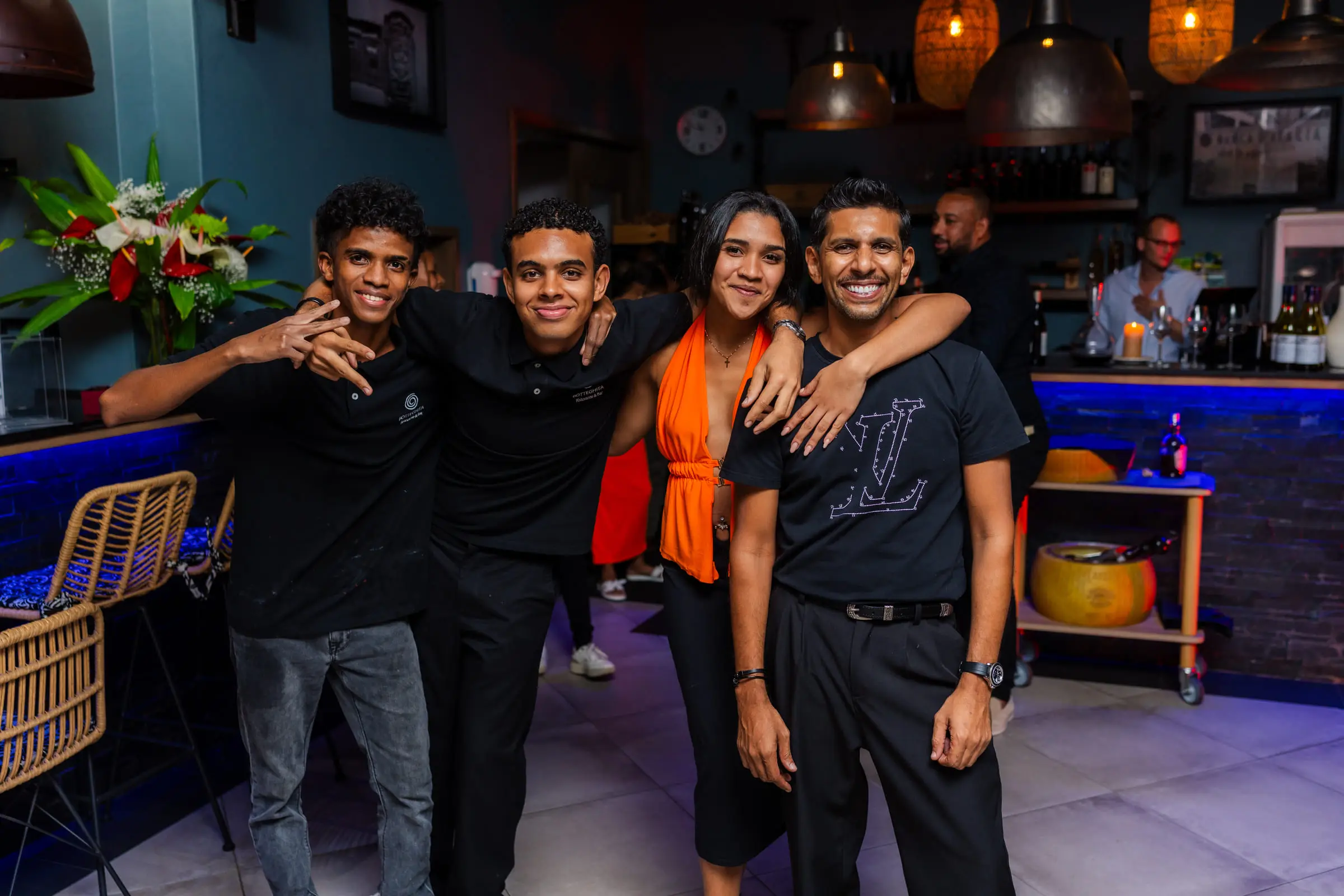 The Botteghita team with guests at the bar