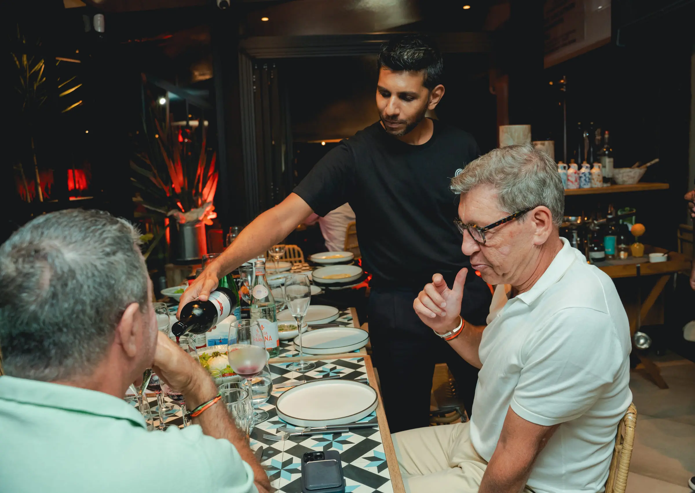Wine poured tableside for guests over dinner